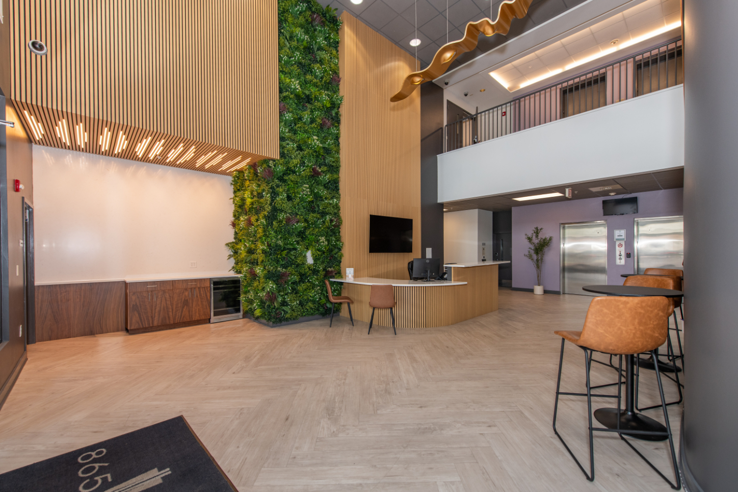 Lobby with tv, desk and chairs