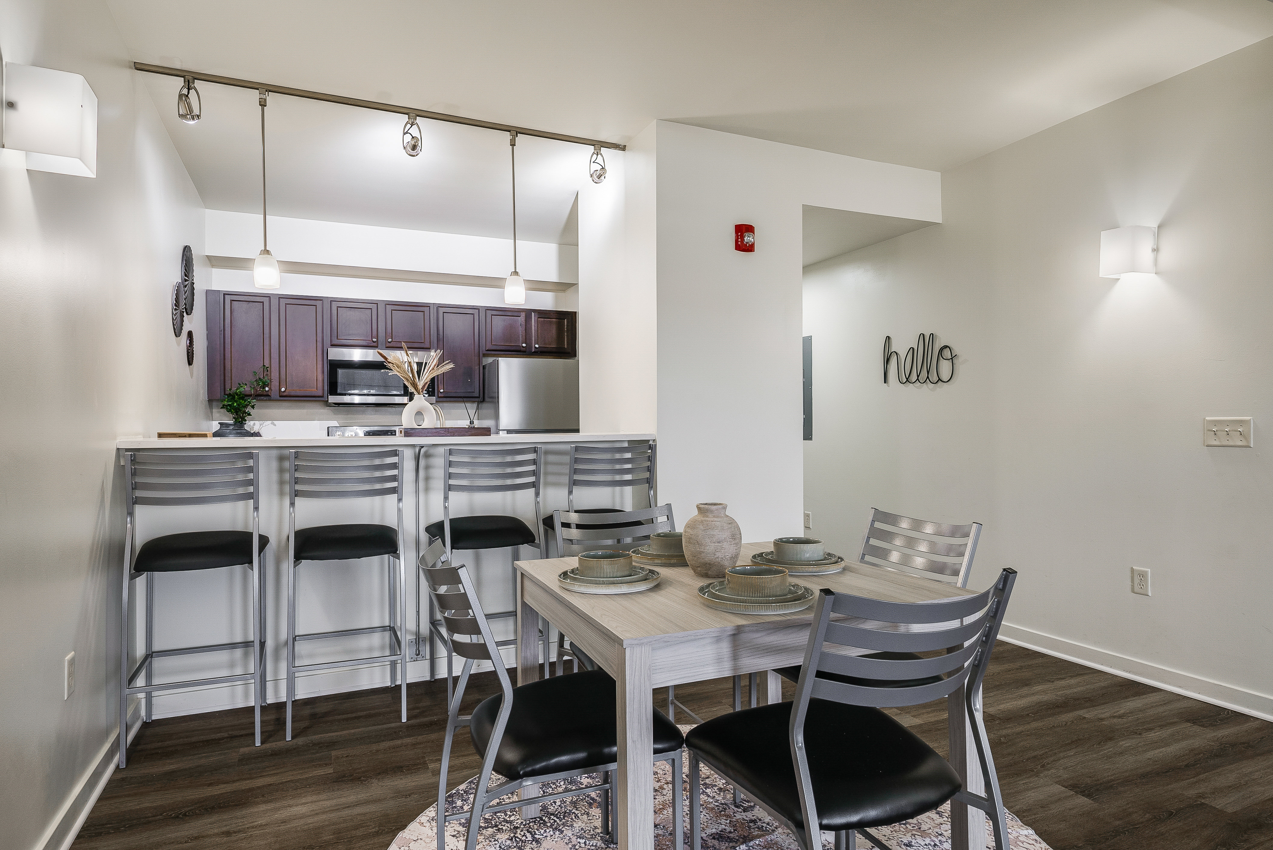 Dining room and view of breakfast bar with table and chairs