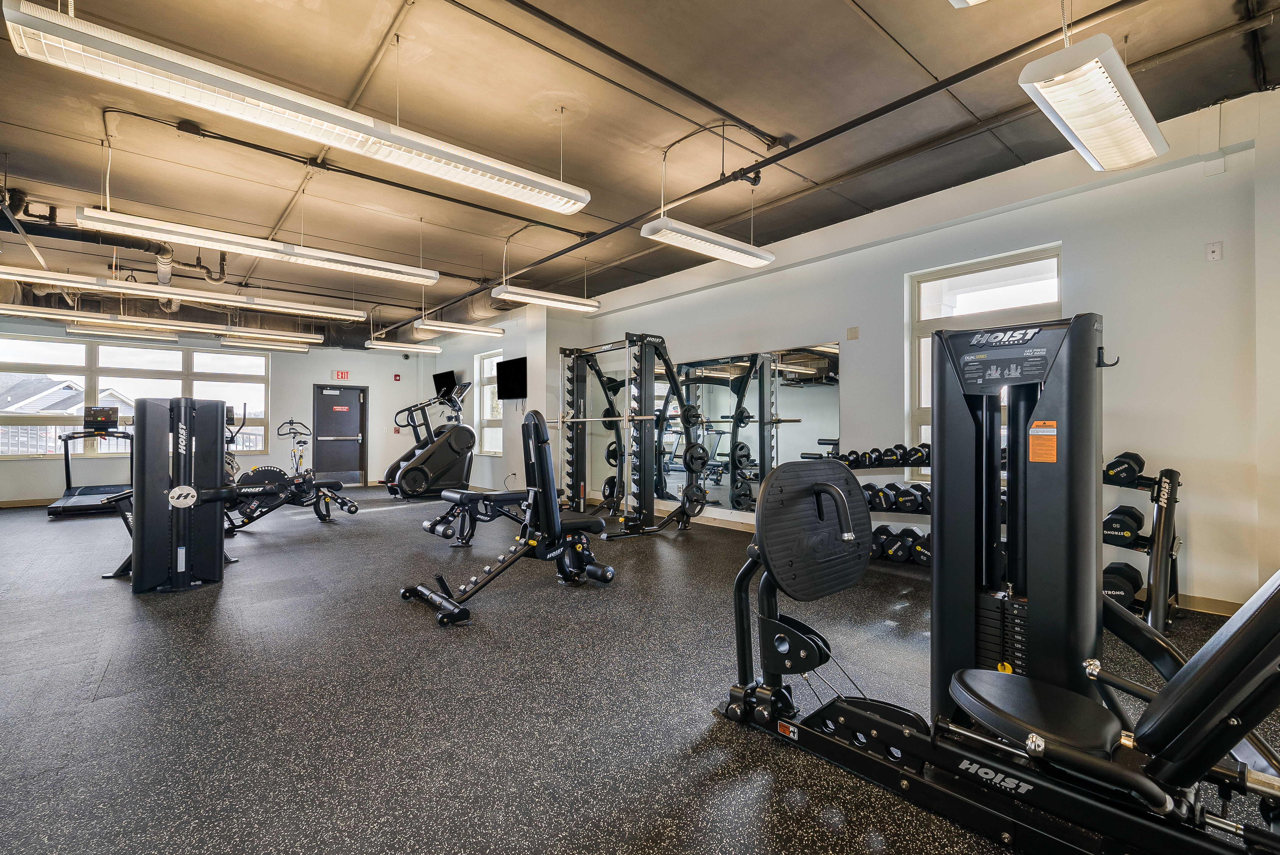 Fitness center with strengthening equipment and machines and free weights