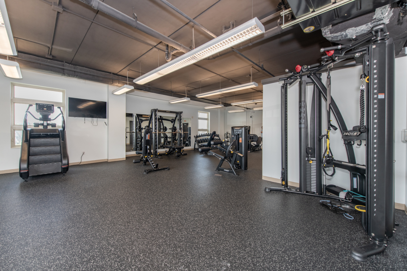 Fitness center with strengthening equipment and machines and free weights