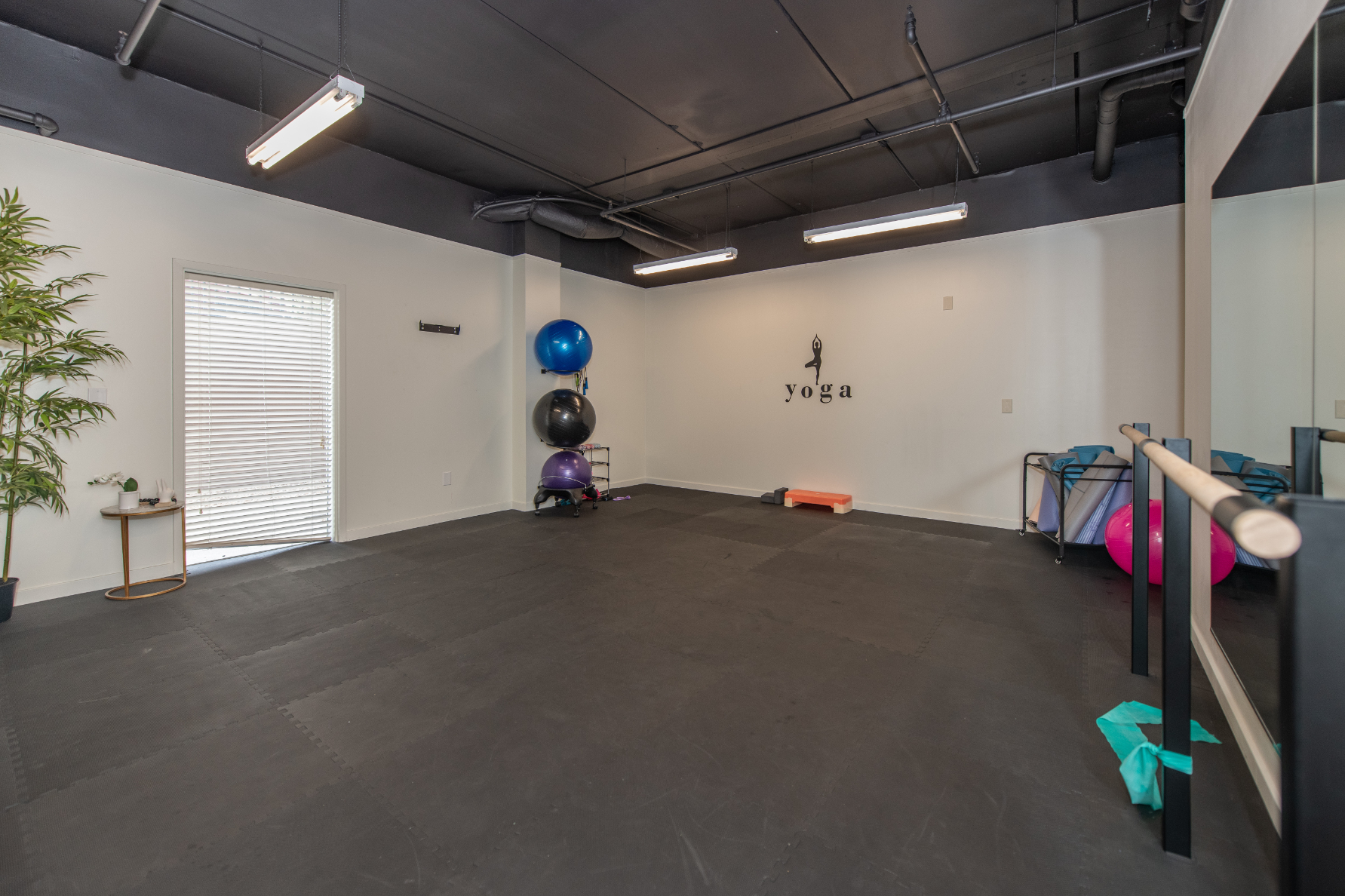 Yoga studio with yoga balls and matts 