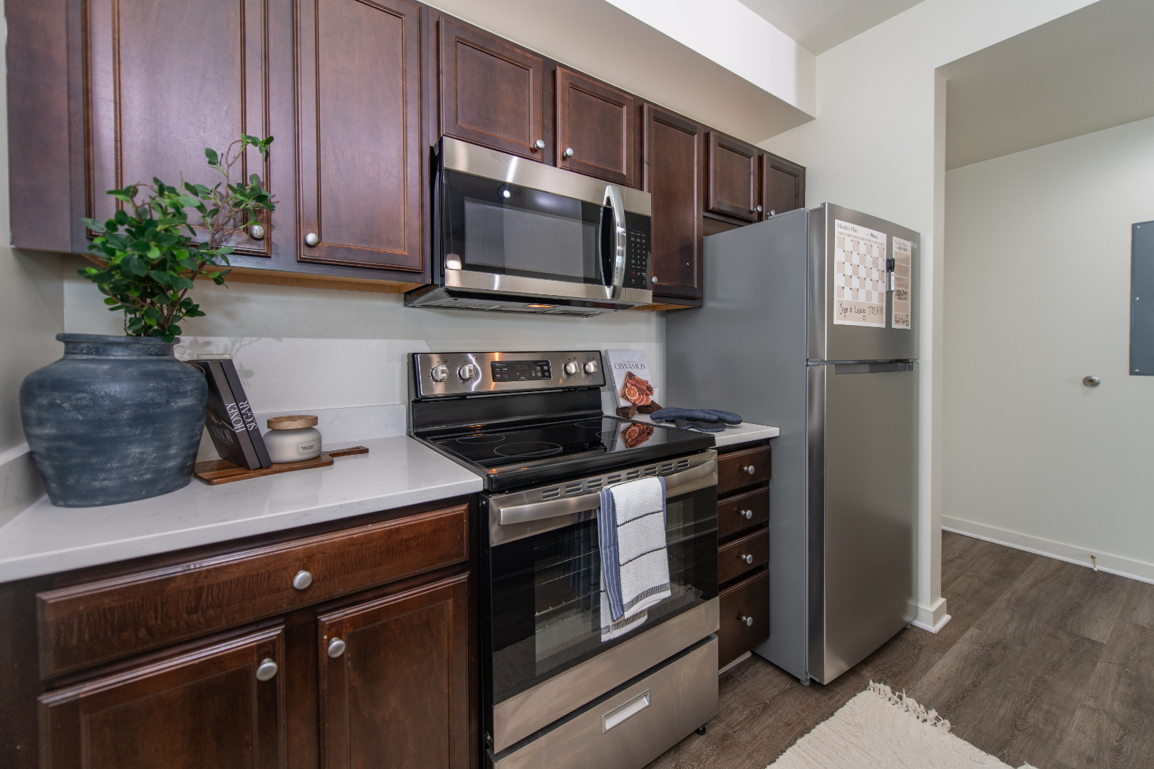 Kitchen with brown cabinets and stainless steel appliances