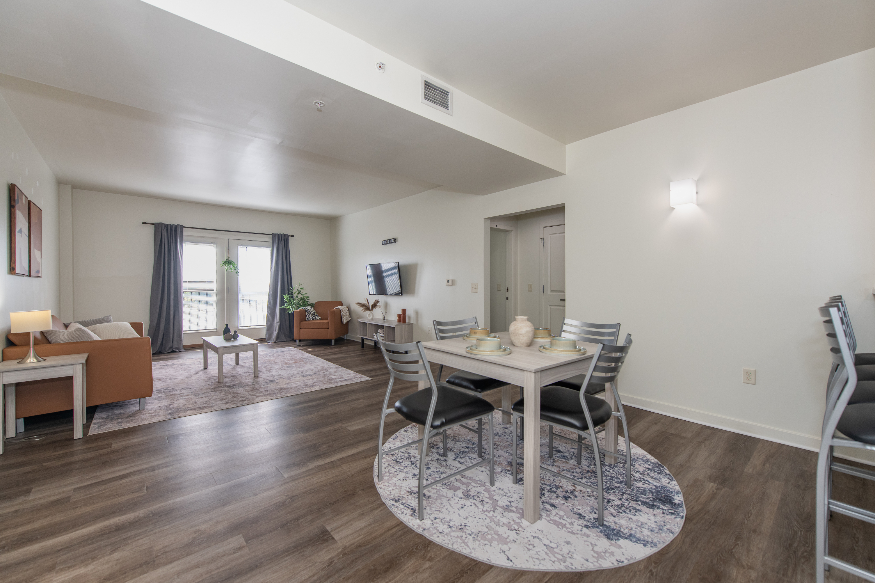 Dining room and view of breakfast bar with table and chairs