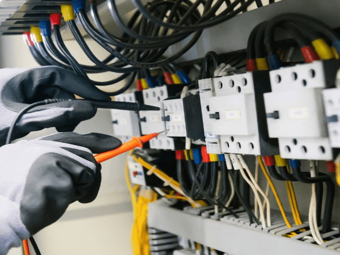 HVAC technician testing electrical components with precision HVAC technician testing electrical components with precision