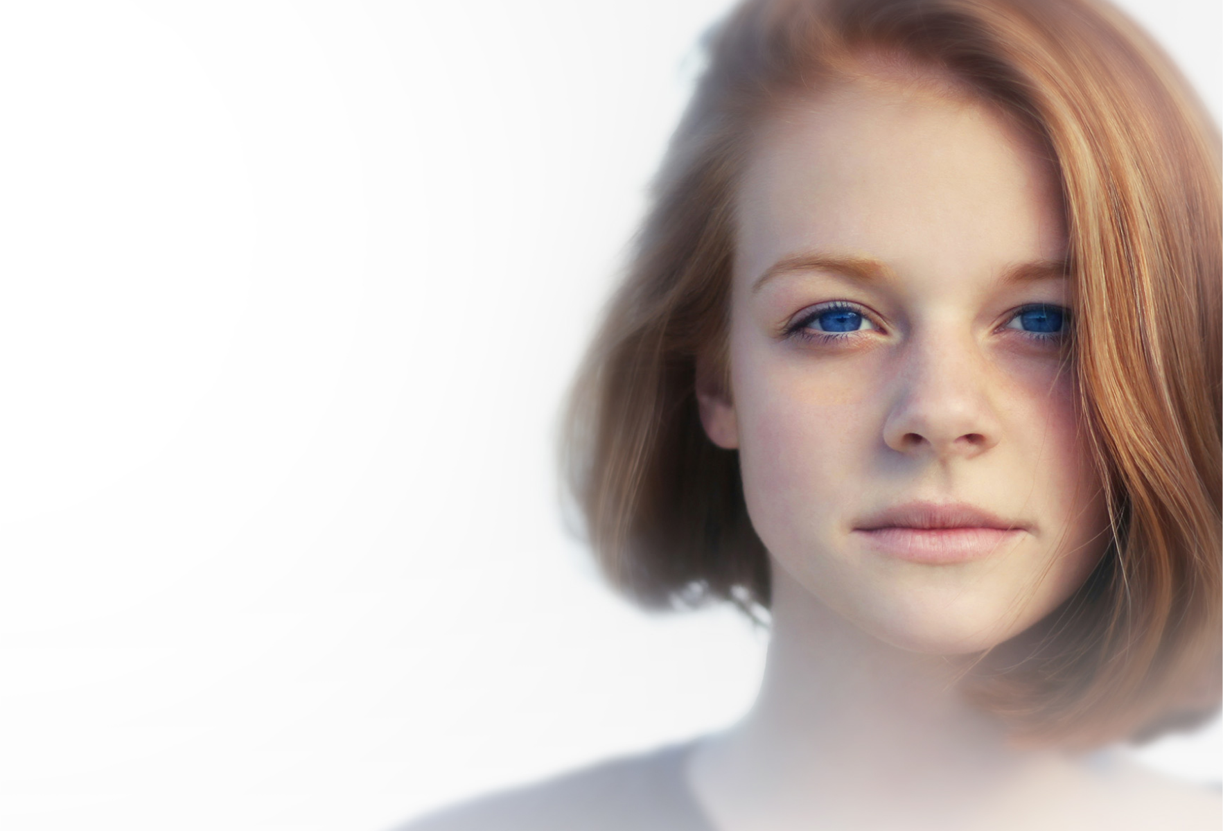 close-up of a redhead with blue eyes