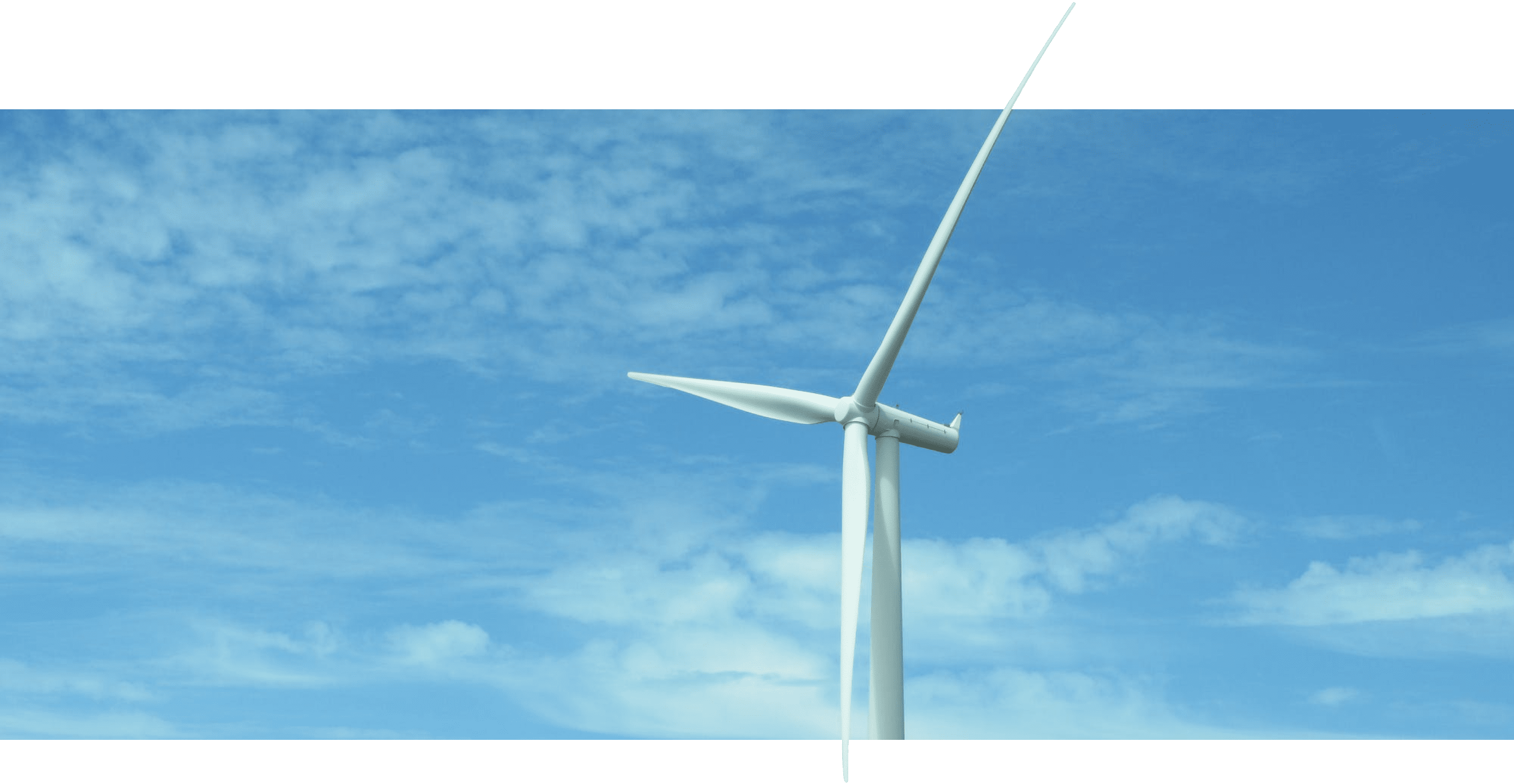 A large wind turbine against a blue sky