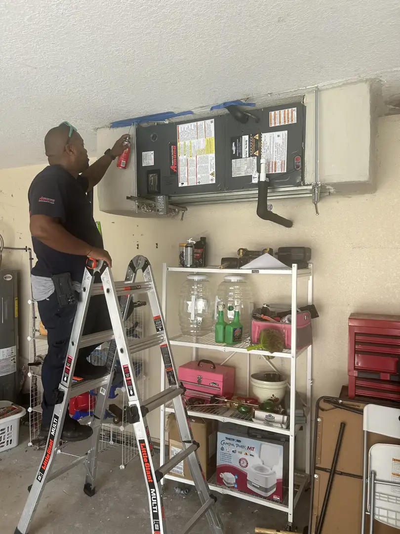 homeowner locating an air handler in a utility closet - how to check and replace your ac air filter