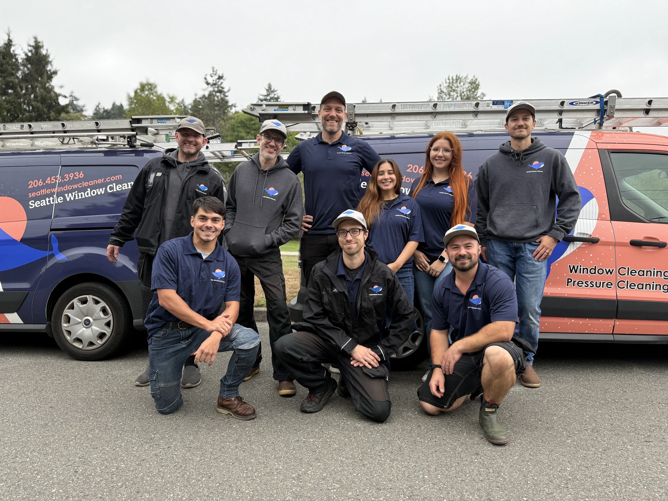 professional Window Cleaning Company Seattle, WA technician washing second-story home windows