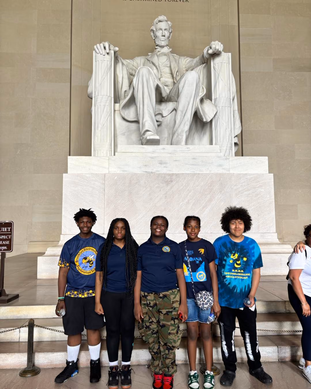 Students posing in front of the Lincoln Memorial statue Washington DC