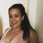 Ms. Danielle Caban smiling in a pink dress