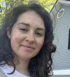 Ms. Gianina Giangrande staff photo outdoors near building