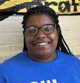 Ms. Quantaysia Marcus smiling in blue school shirt
