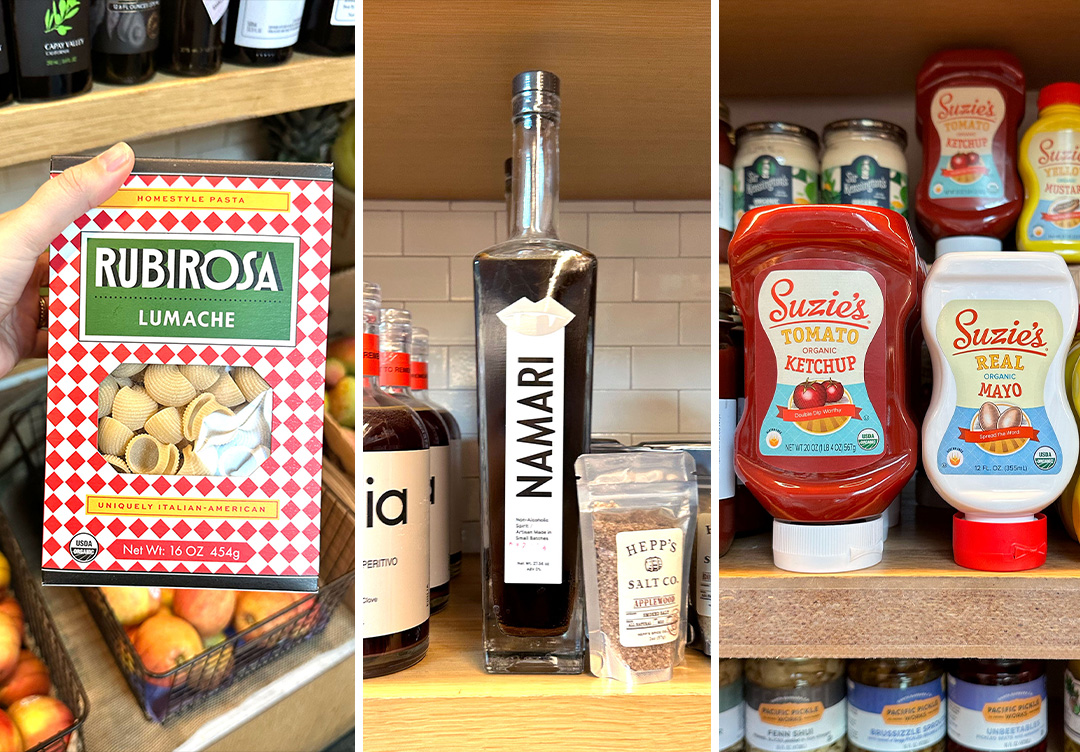 A red pasta box with Rubirosa over the top, a skinny non-alcoholic spirit bottle, and two condiment squeeze bottles
