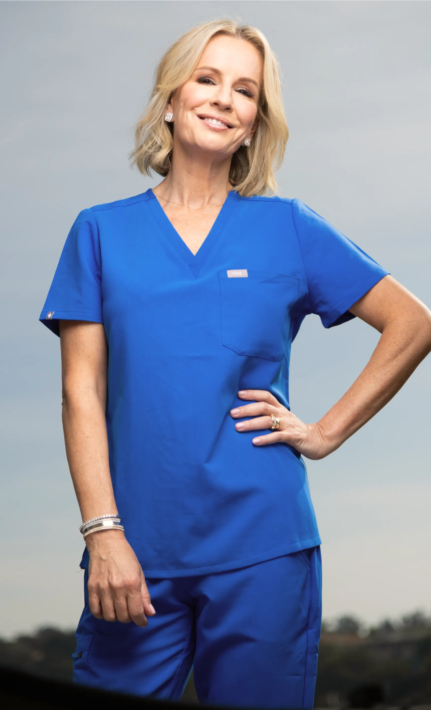 Dr. Jen Ashton in scrubs—bringing expertise from clinic to community.