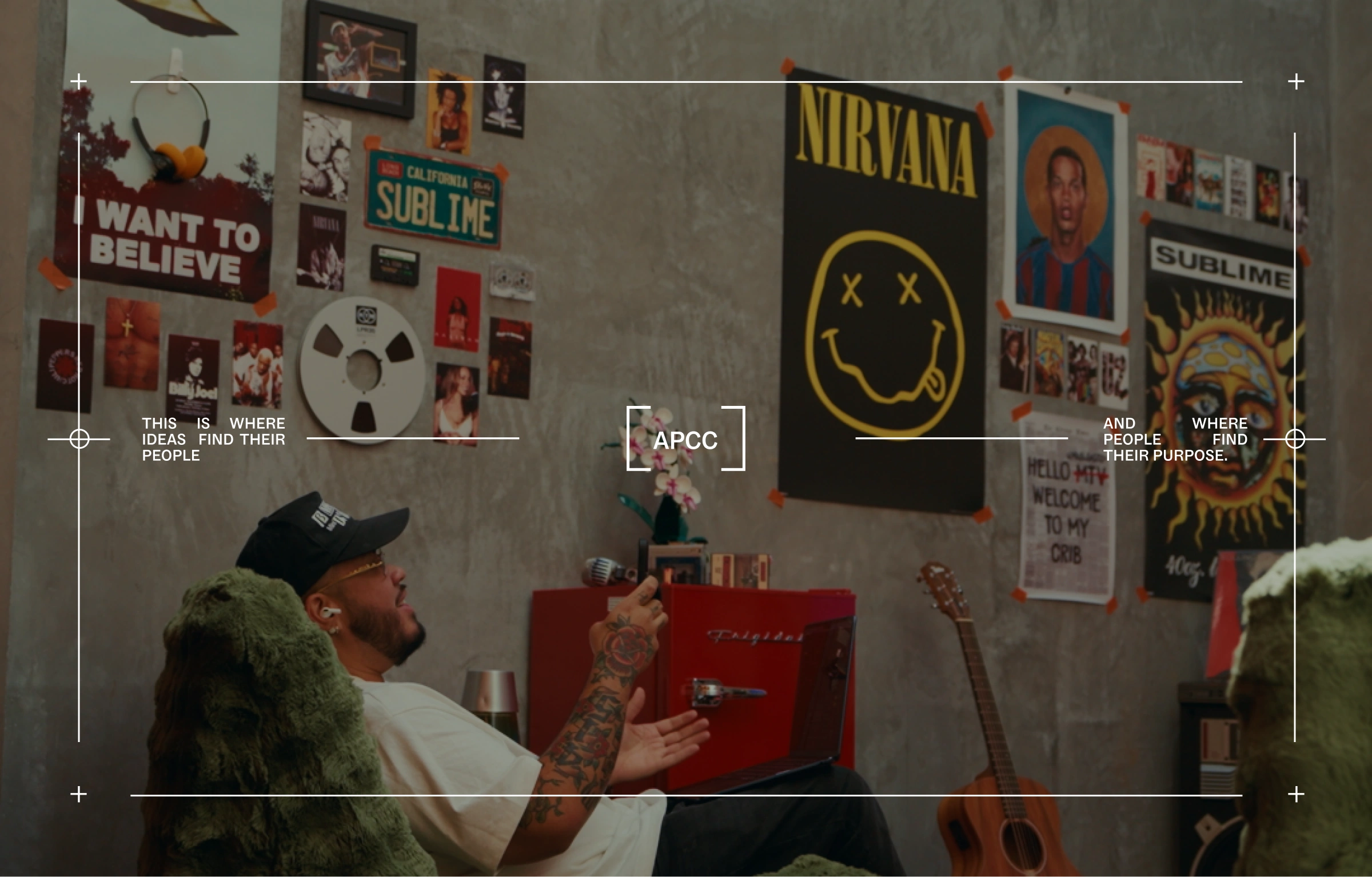 Photo of Adrian Per in his office with overlaid branded elements, including the logo, crosshairs, and stylized text.