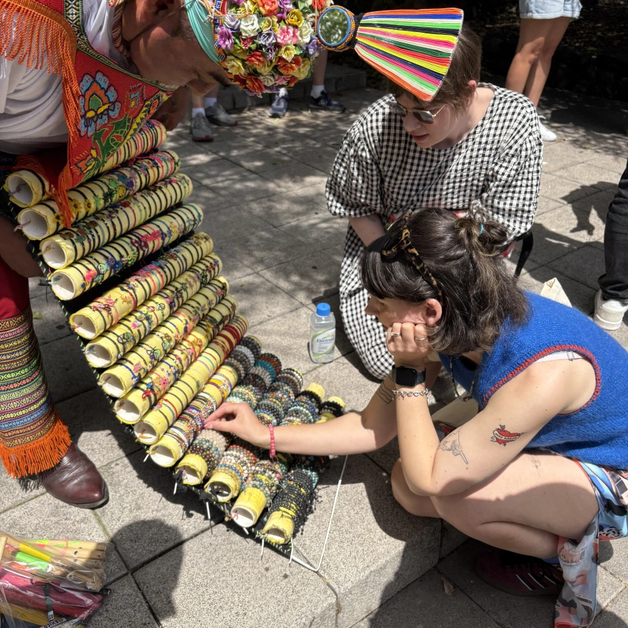 Emmy, one of our directors, looking at bracelets from a street vendor