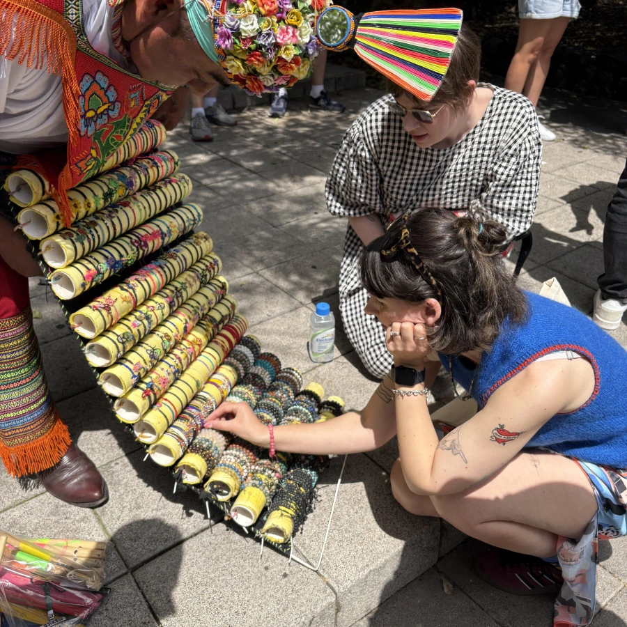 Emmy, one of our directors, looking at bracelets from a street vendor
