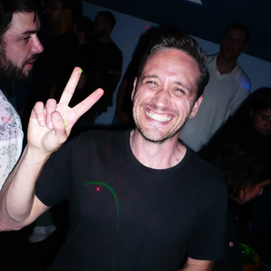 James, our WP of Design, smiles and holds up the peace sign