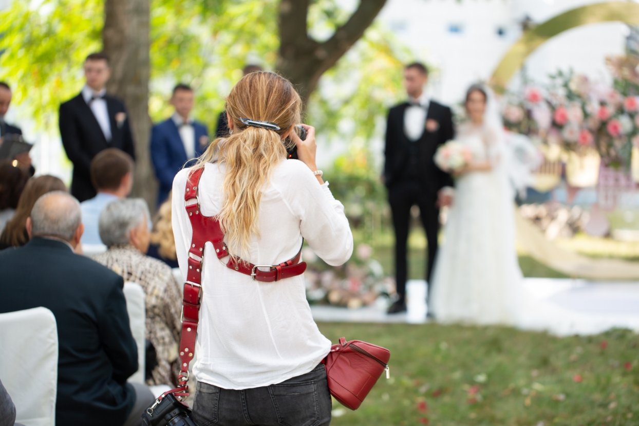 Wedding photographer capturing a photo of the couple