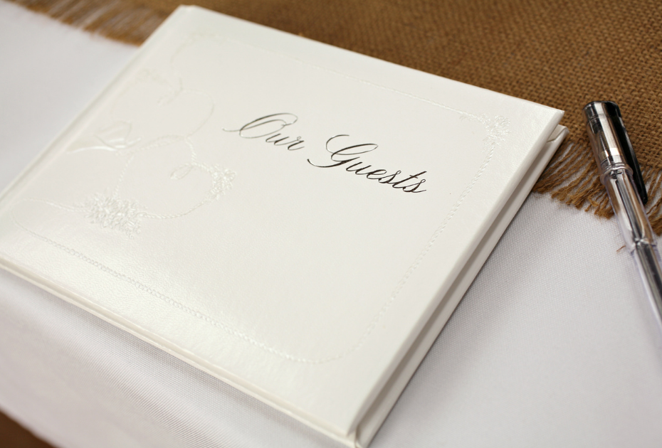 Wedding guest book pictures: a guest book that says "Our Guests"