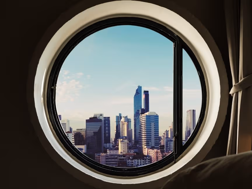 round window looking out into city.