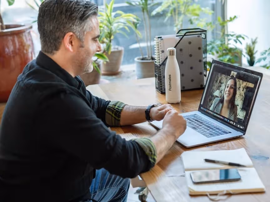 man working remotely from home on laptop