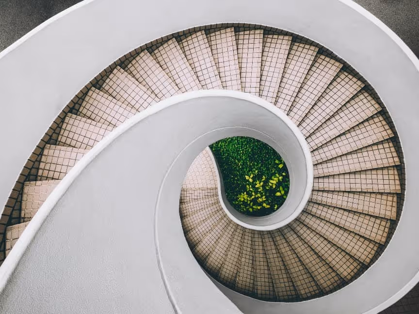white-and-brown-concrete-spiral-stairs