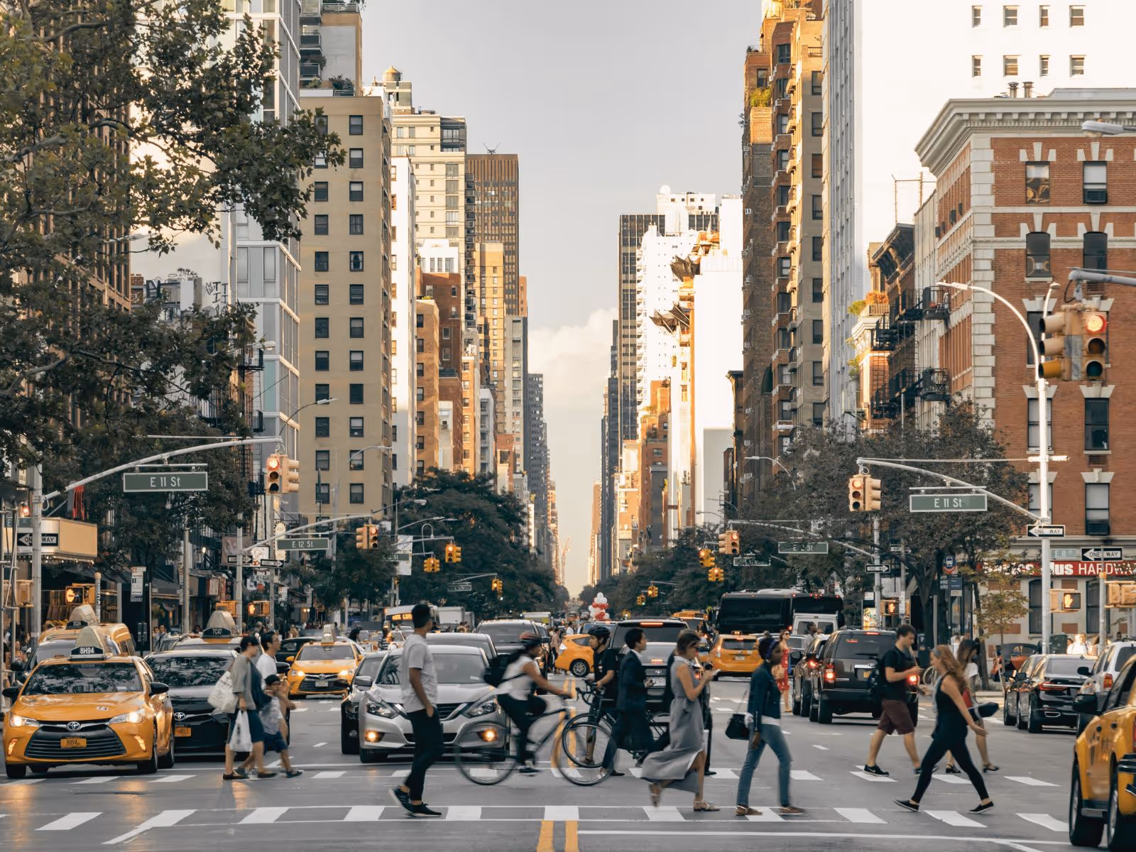 people crossing busy crosswalk during their commute