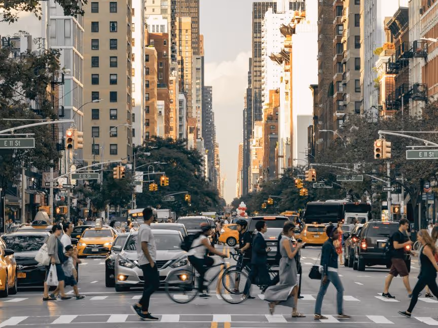 people crossing busy crosswalk during their commute