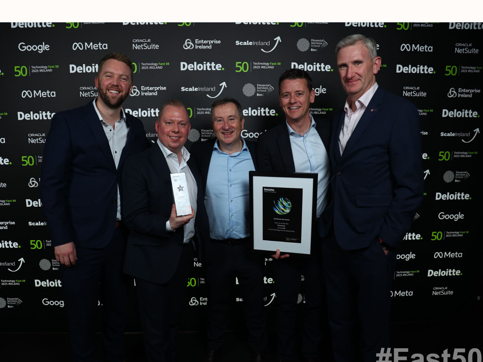 Otonomee team lined up with Deloitte Fast 50 Technology Award in hand