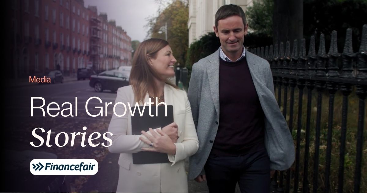 Real Growth Stories title on a photo of Aidan and Hilary O'Shea walking in the street 
