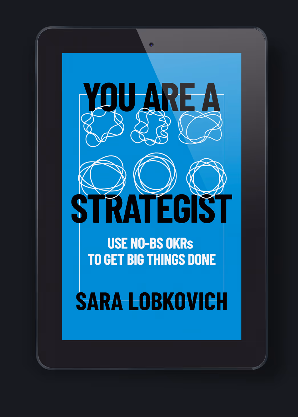 A digital tablet displaying the cover of the book "You Are a Strategist" by Sara Lobkovich. The cover features a bright blue background with various abstract circular designs and bold black text. Related to publisher book design services.