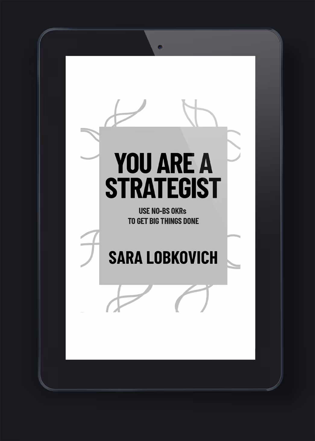 A digital tablet displaying the book cover of 'You Are a Strategist' by Sara Lobkovich. The cover features bold black text on a white background with a simple design, emphasizing the title and subtitle about using OKRs for goal achievement.