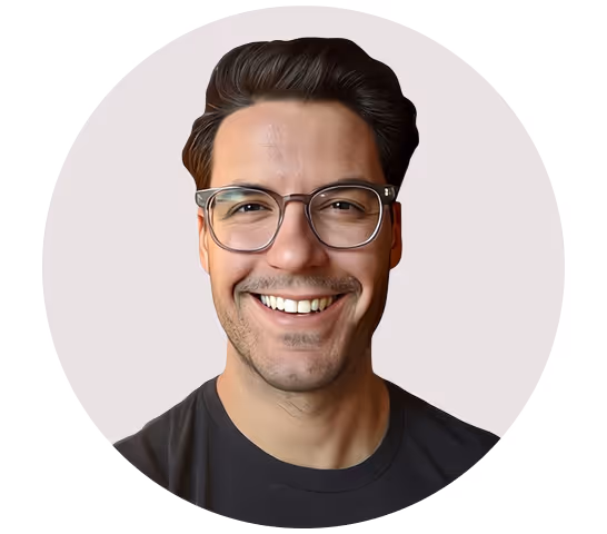 A smiling man with glasses and styled dark hair, shown in a circular frame with a light background. He is wearing a black t-shirt. This image may represent a professional involved in book design for publishers, including book cover design and ebook design.