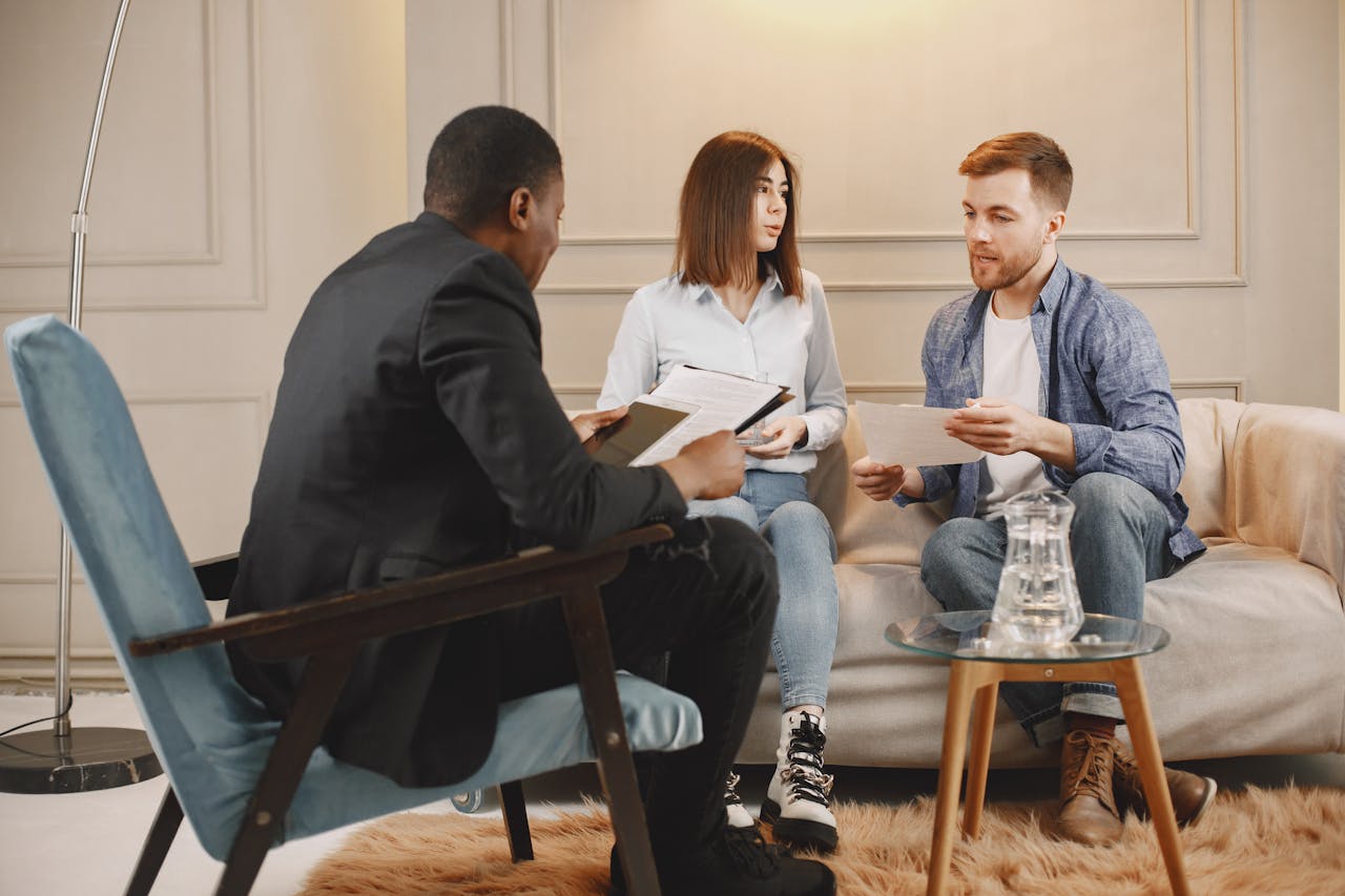 A couple together with a therapist during their session