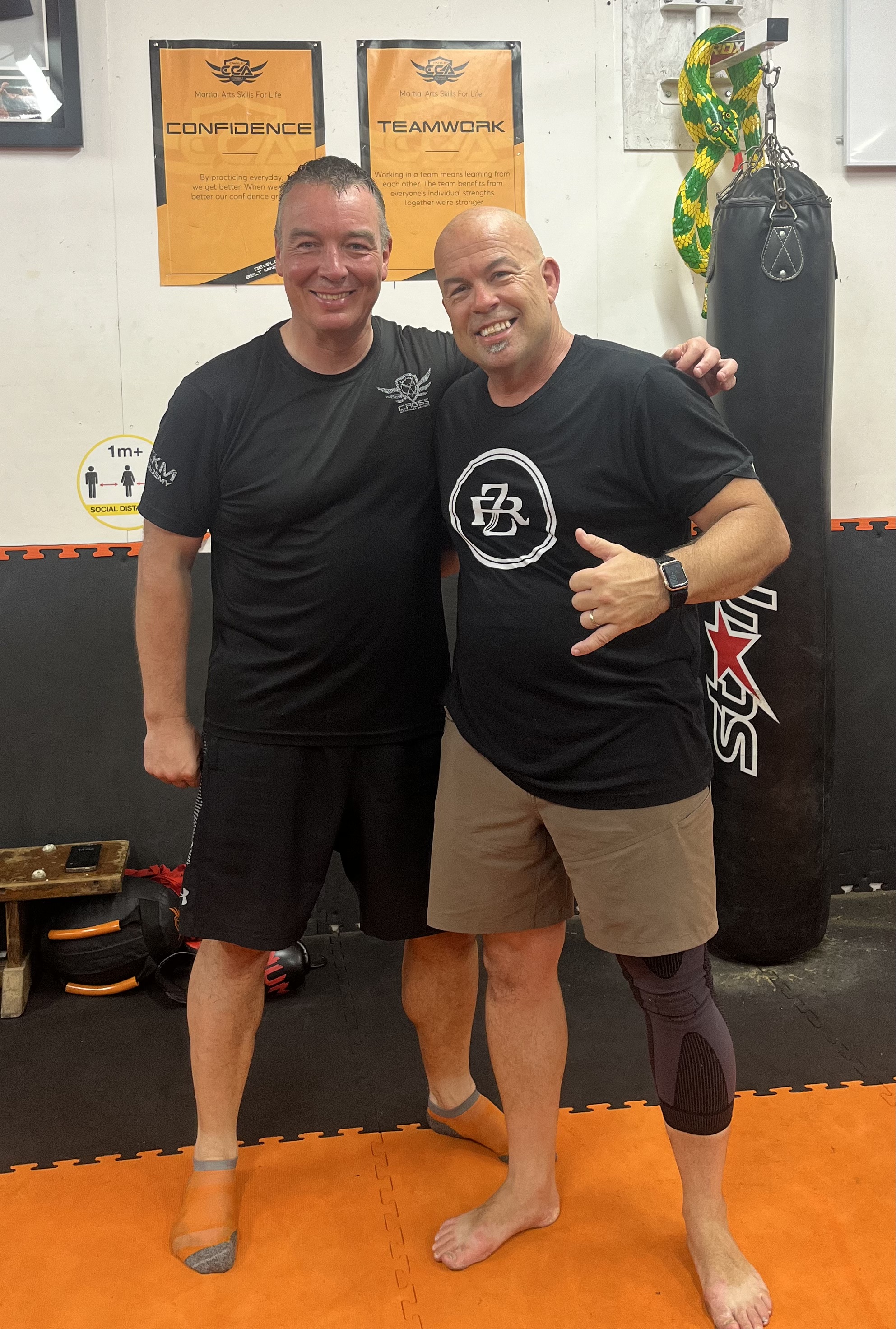 The author getting some self defence coaching advice from a Jiu Jitsu expert