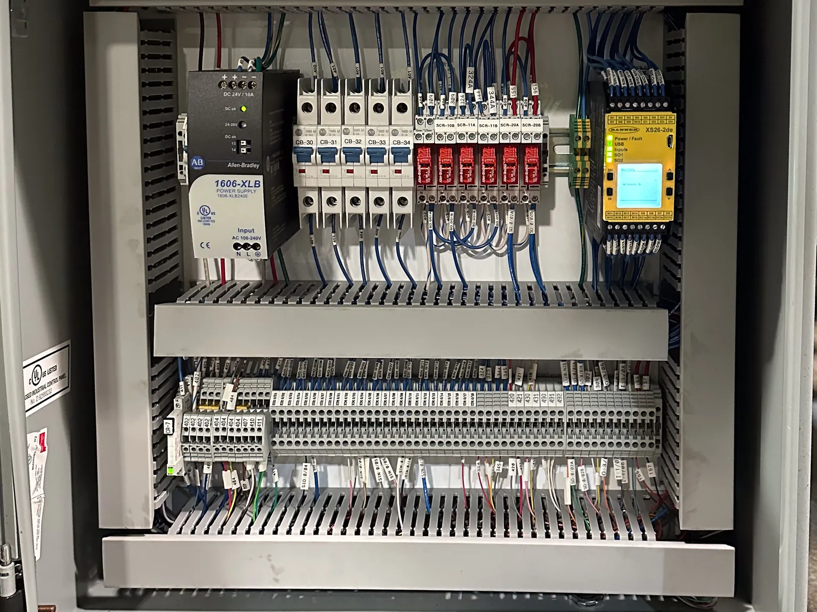 New control enclosure after rebuild, with components mounted on a subpanel and all wiring run in slotted duct.