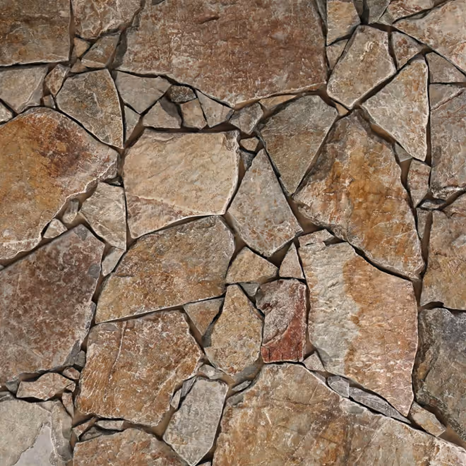 Close-up of irregularly shaped brown and beige stone tiles arranged closely together.