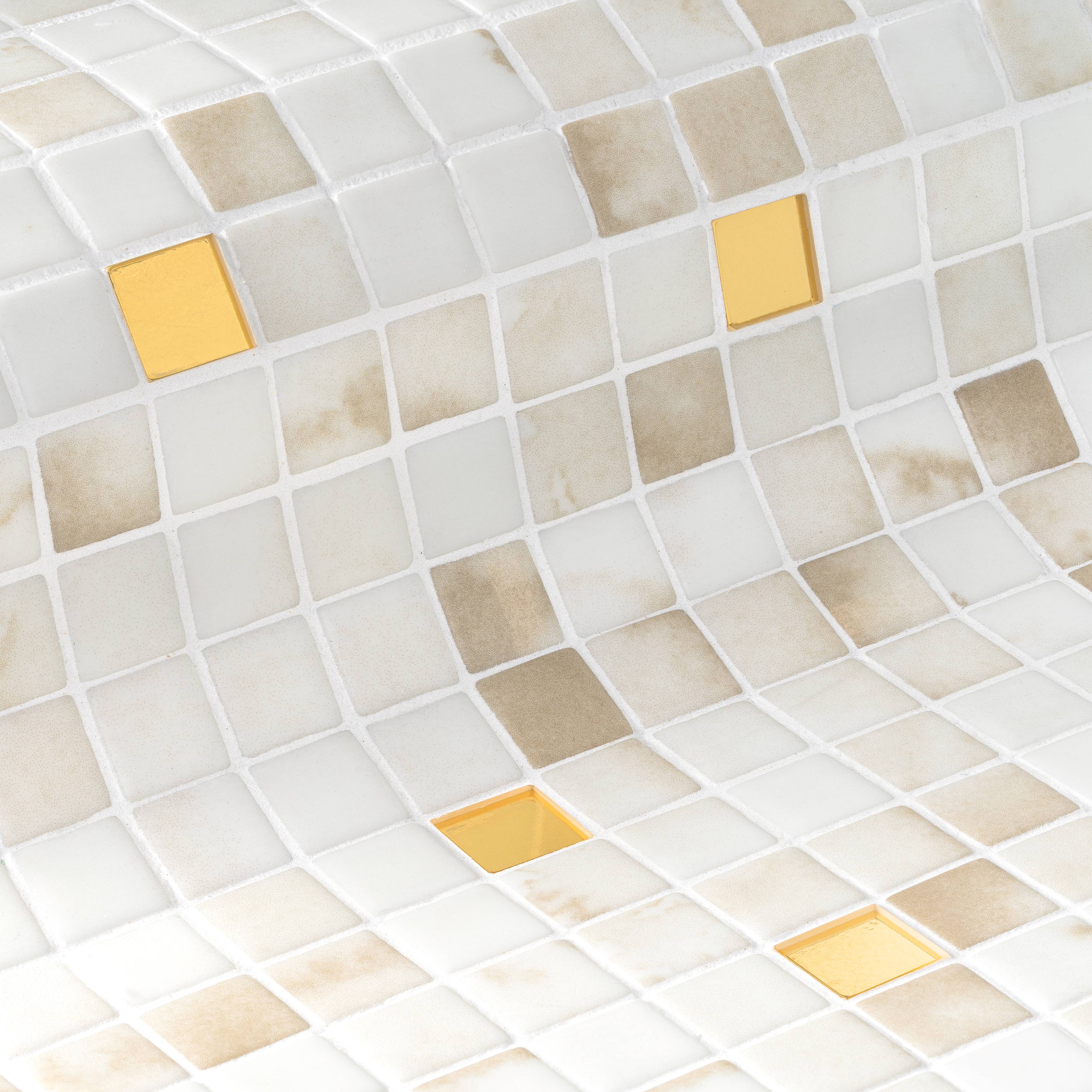 Curved mosaic wall with small square tiles in white, beige, and four bright golden yellow accents.