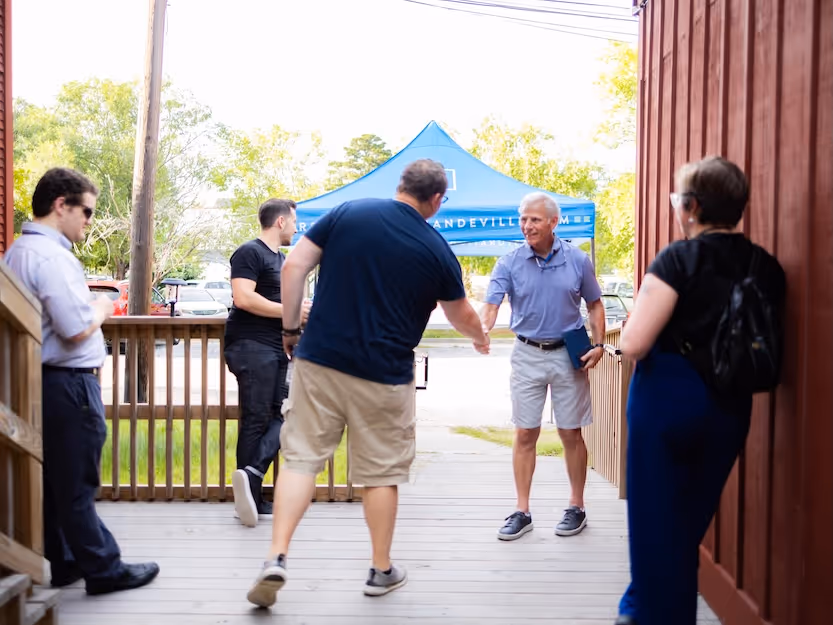 People shaking hands outside the North Star Theatre attending Restoration Community Church