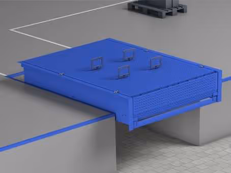 Blaues Gleisfeld mit vier elektrischen Kontakten auf einem grauen Betonboden.