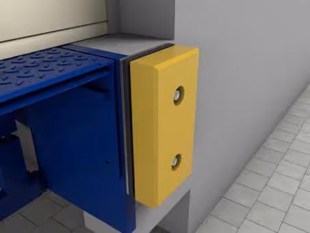 Nahaufnahme eines blauen und gelben Gerätegehäuses an einer grauen Wand über einem gepflasterten Boden.