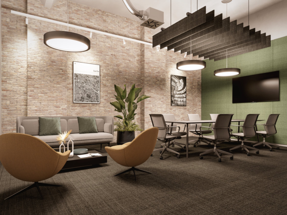 Gemütlicher Raum mit Sofaecke, Konferenztisch, modernen Stühlen, Pflanzen, Ziegelwand und Hängelampen.