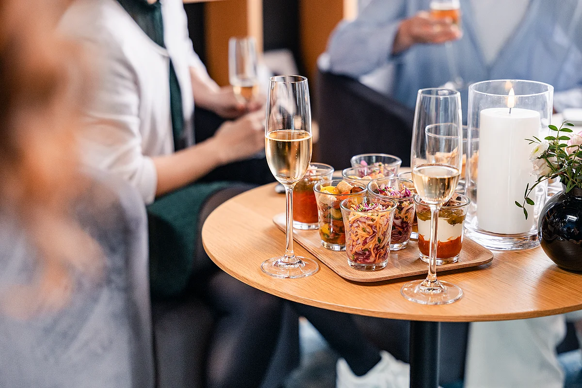 Reception with finger food and sparkling wine at an ecos work spaces event space