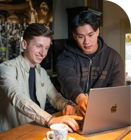 a man looking at a laptop