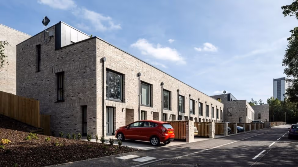 Image of a pale brick residential building