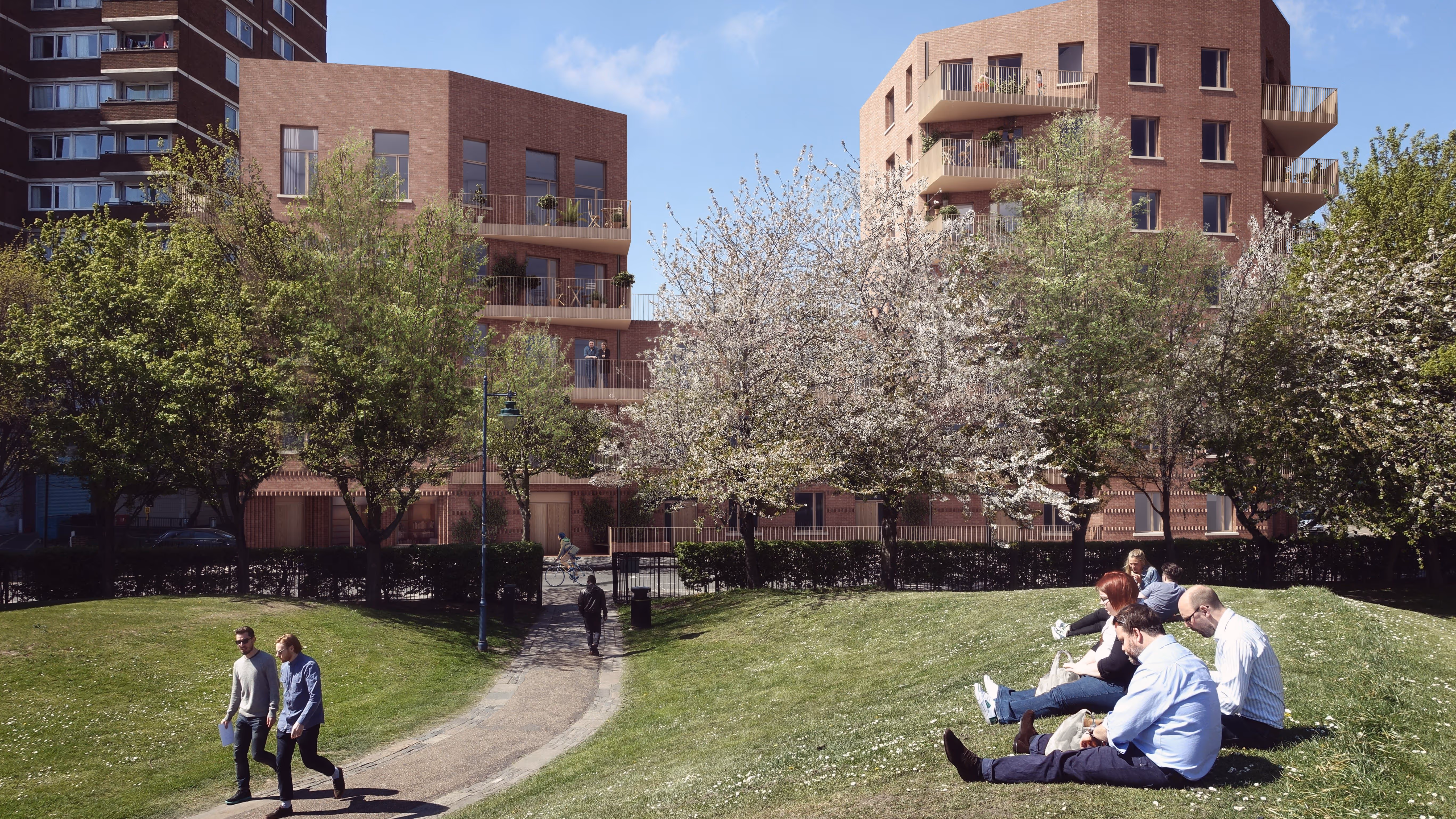 People enjoying green space with Marklake Court in the background