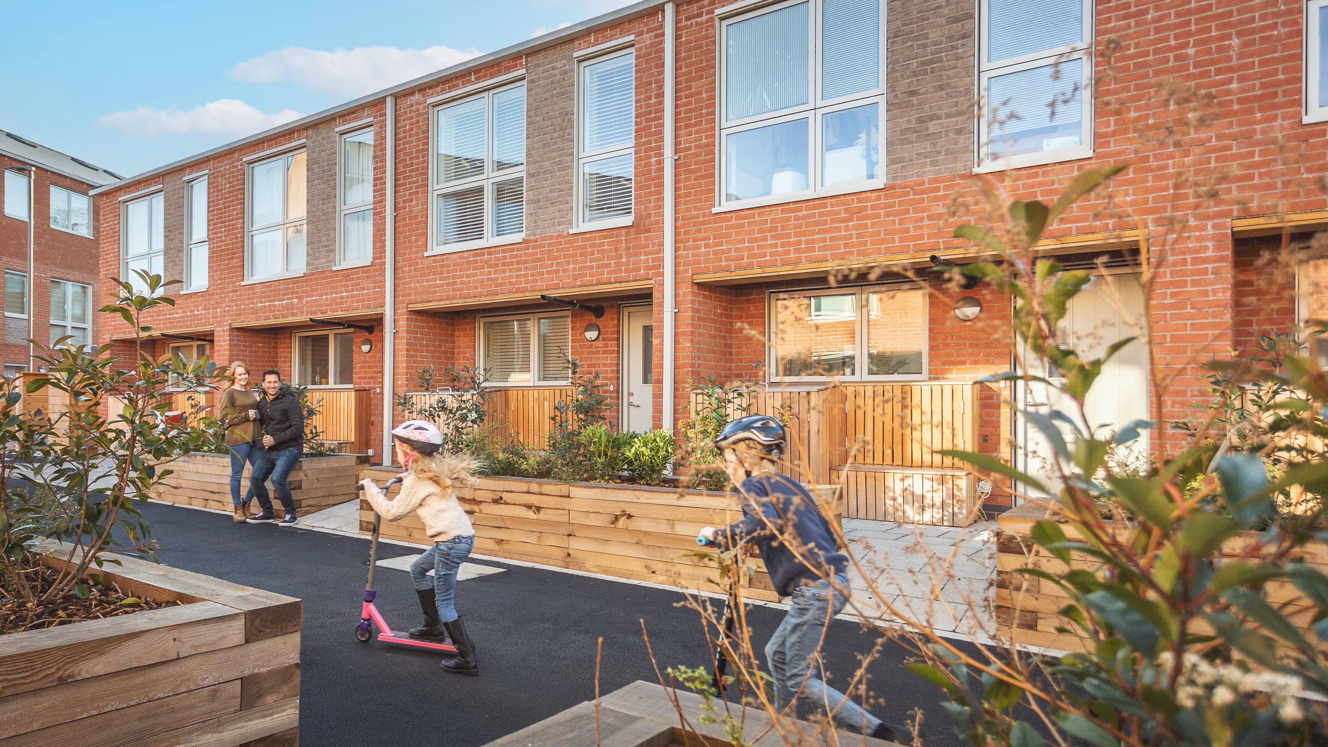 A family enjoying the courtyard of Mundella 