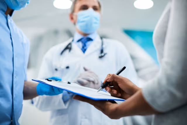 Someone signing a medical document