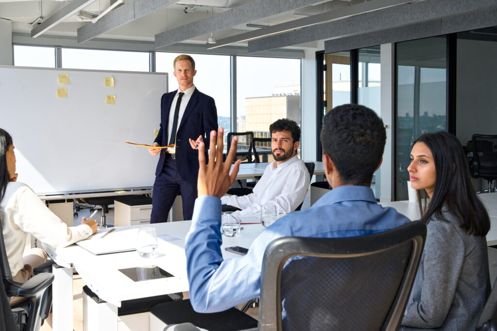 Businessman manager leader answering questions during presentation training